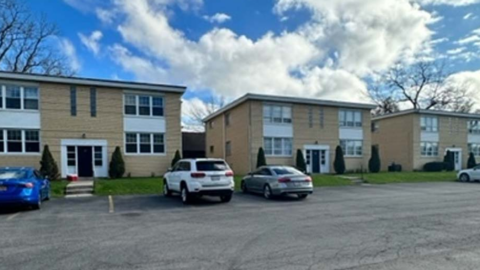 Exterior photo showing two buildings and the parking lot at 30 Linwood in Williamsville, NY