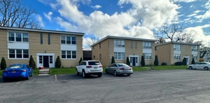 Exterior photo showing two buildings and the parking lot at 30 Linwood in Williamsville, NY